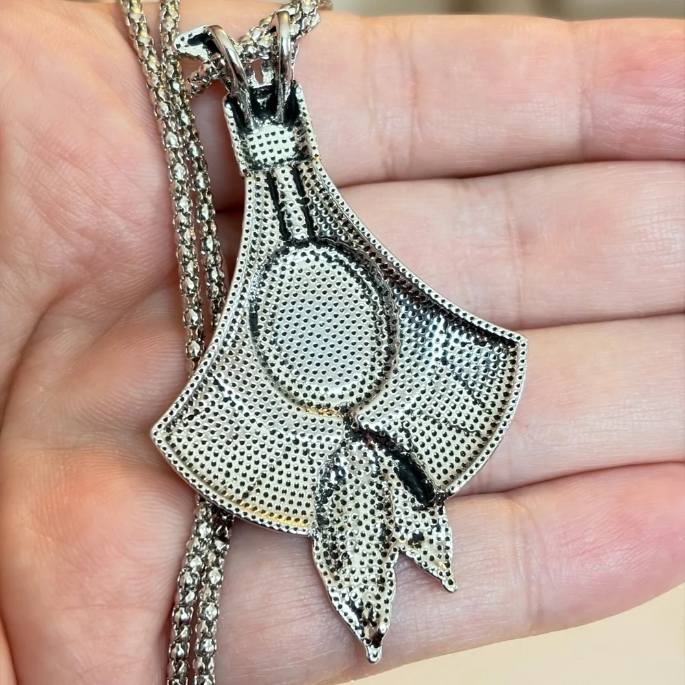Bohemian Silver Pendant Necklace with Turquoise and Red Accents.